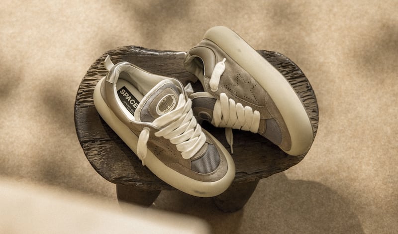 Space-star-sneakers-on-a-rug-close-to-a-record-player