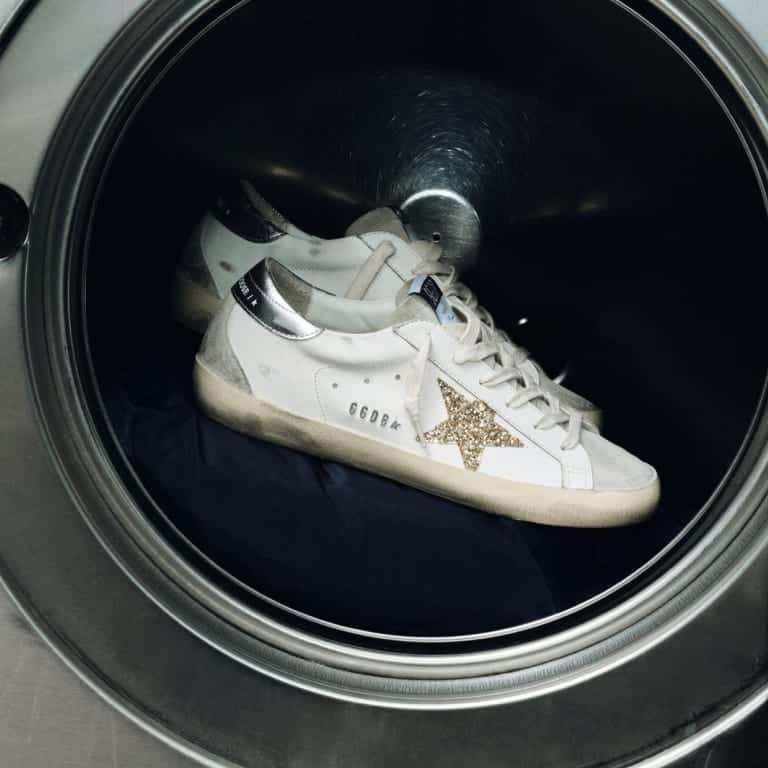super-star-with-gold-glitter-star-and-ice-gray-suede-inserts-with-background-of-a-washing-machine-porthole