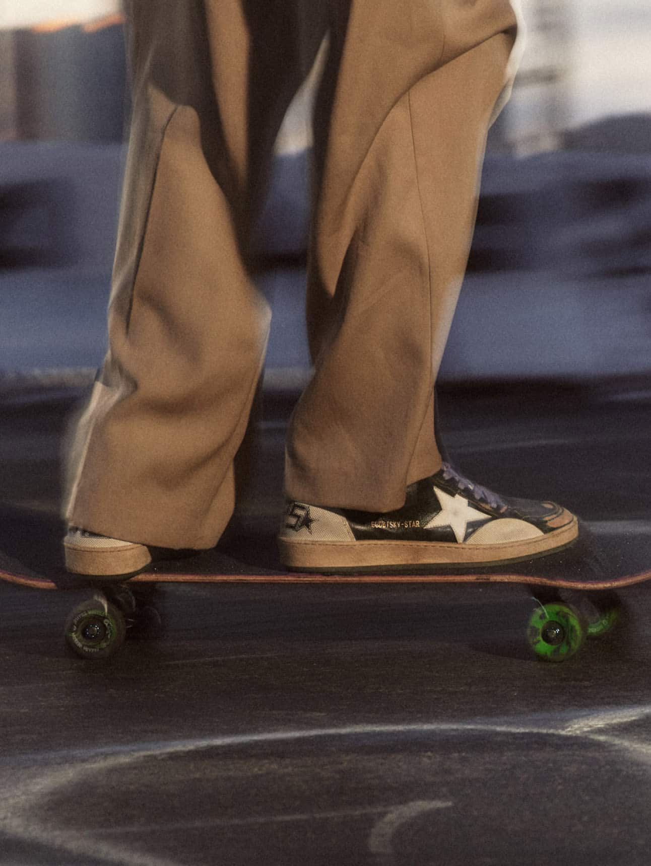 Skater-wearing-sky-star-sneakers-on-her-skateboard