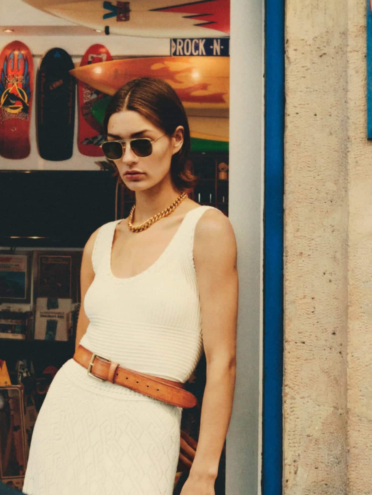 woman-wearing-sunglasses-and-a-white-dress