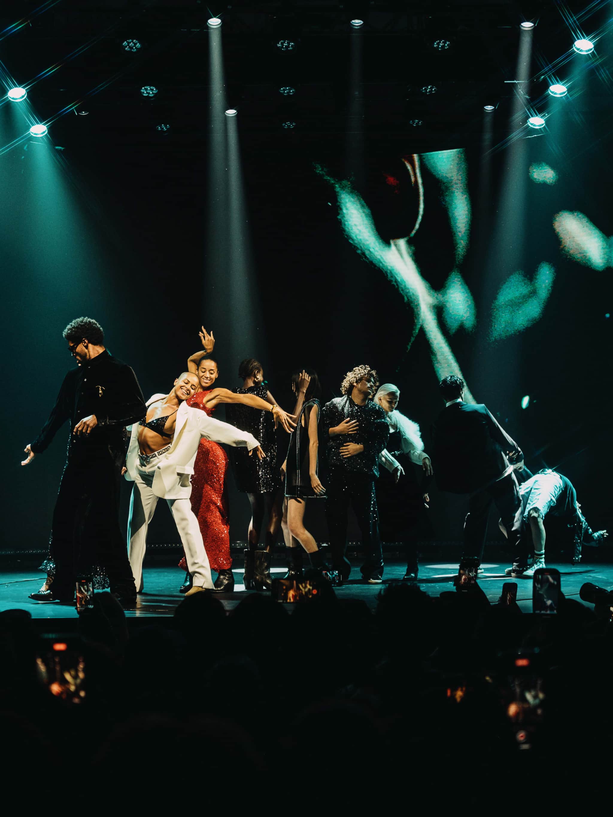performers-on-dark-stage-with-light-green-lighting