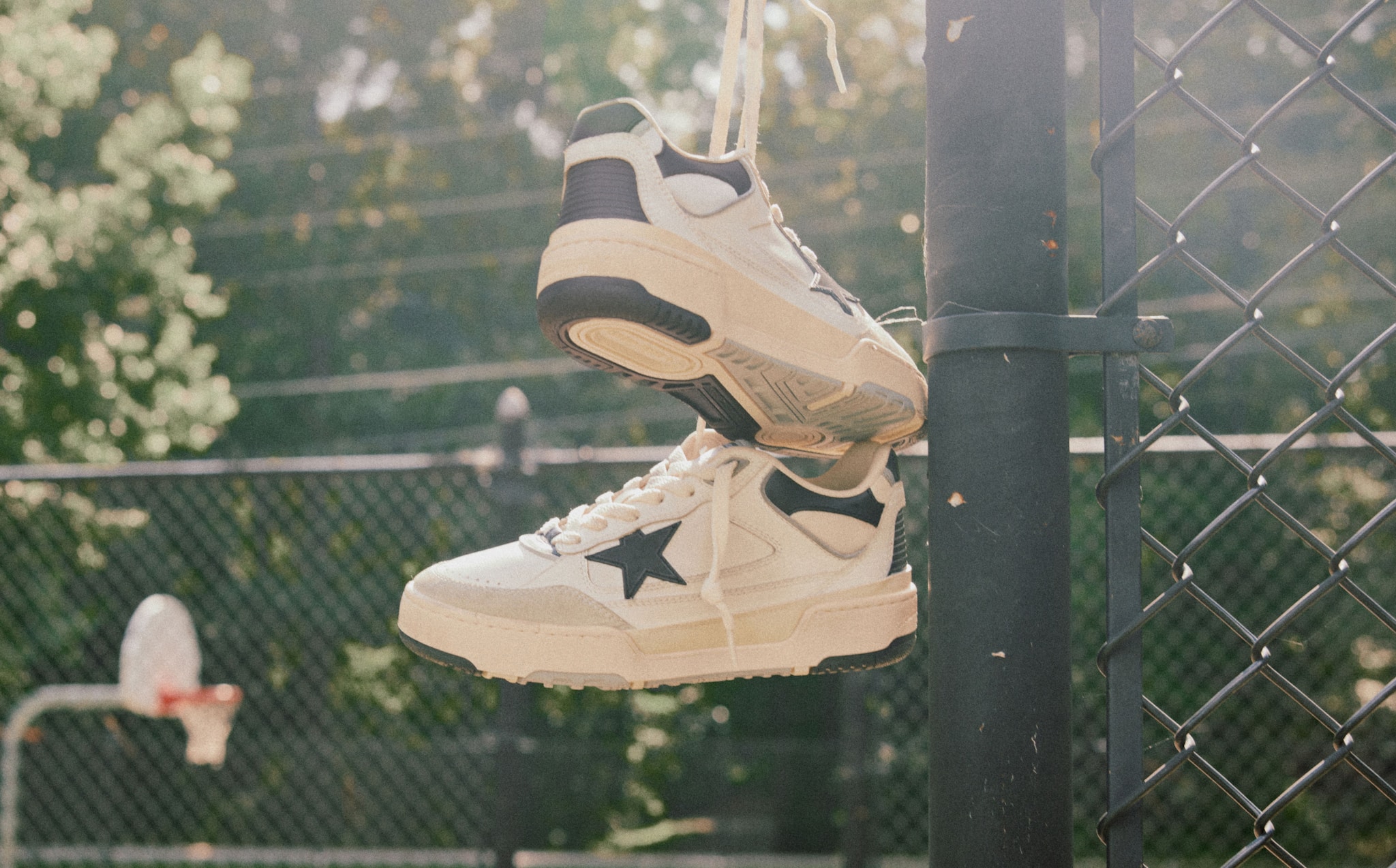 forty2-sneakers-with-black-star-hanging-on-a-playing-field