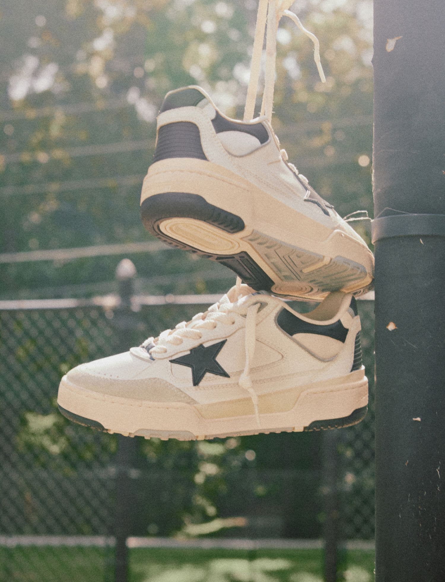 forty2-sneakers-with-black-star-hanging-on-a-playing-field