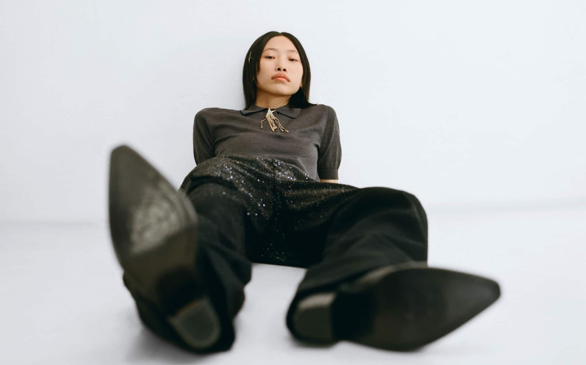 woman-lying-and-wearing-golden-collection-clothes