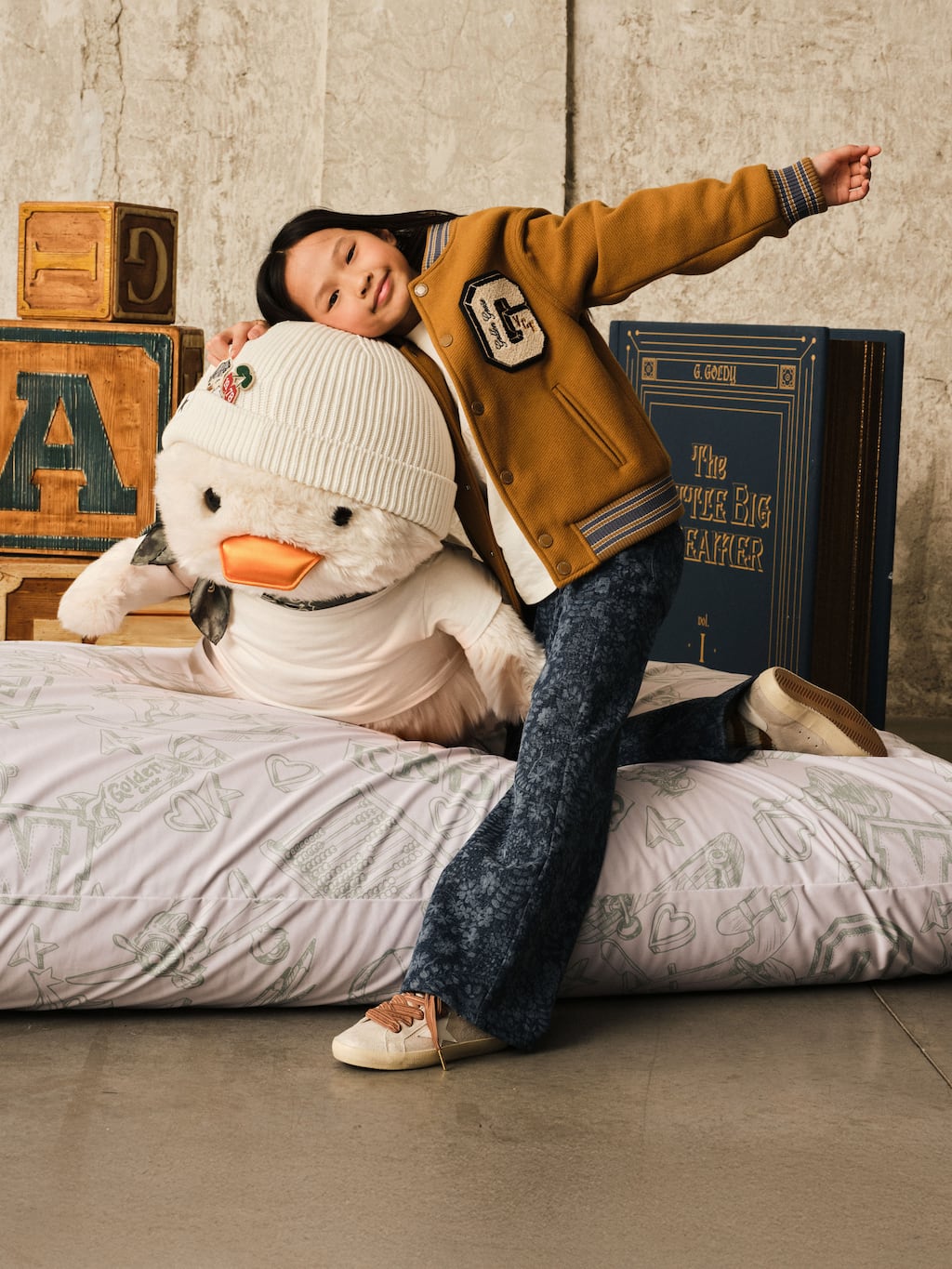girl-hugging-goldy-stuffed-duck