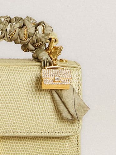 green-venezia-.leather-bag-with-gold-charms