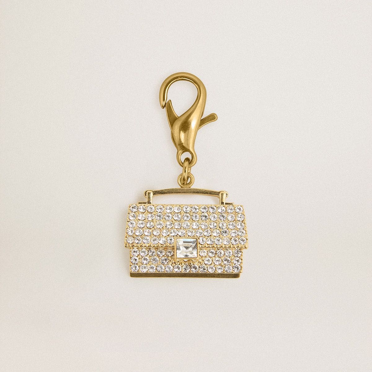 Purse-shaped-charm-in-gold-colored-brass-with-crystals