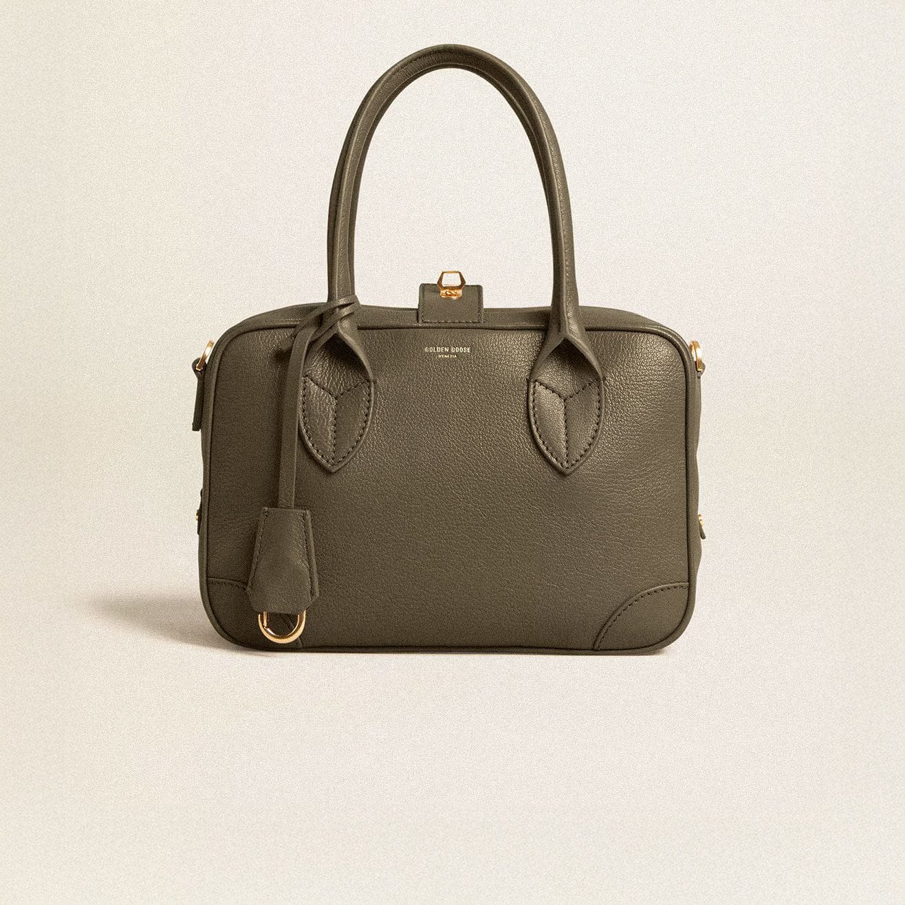 green-vita-bag-on-neutral-background
