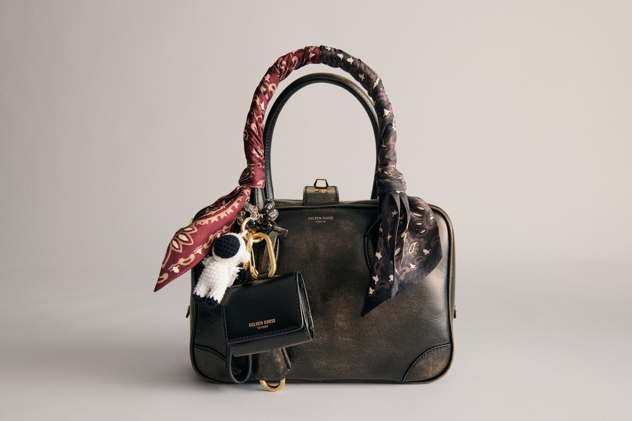 on-model-brown-leather-vita-bag-with-charms