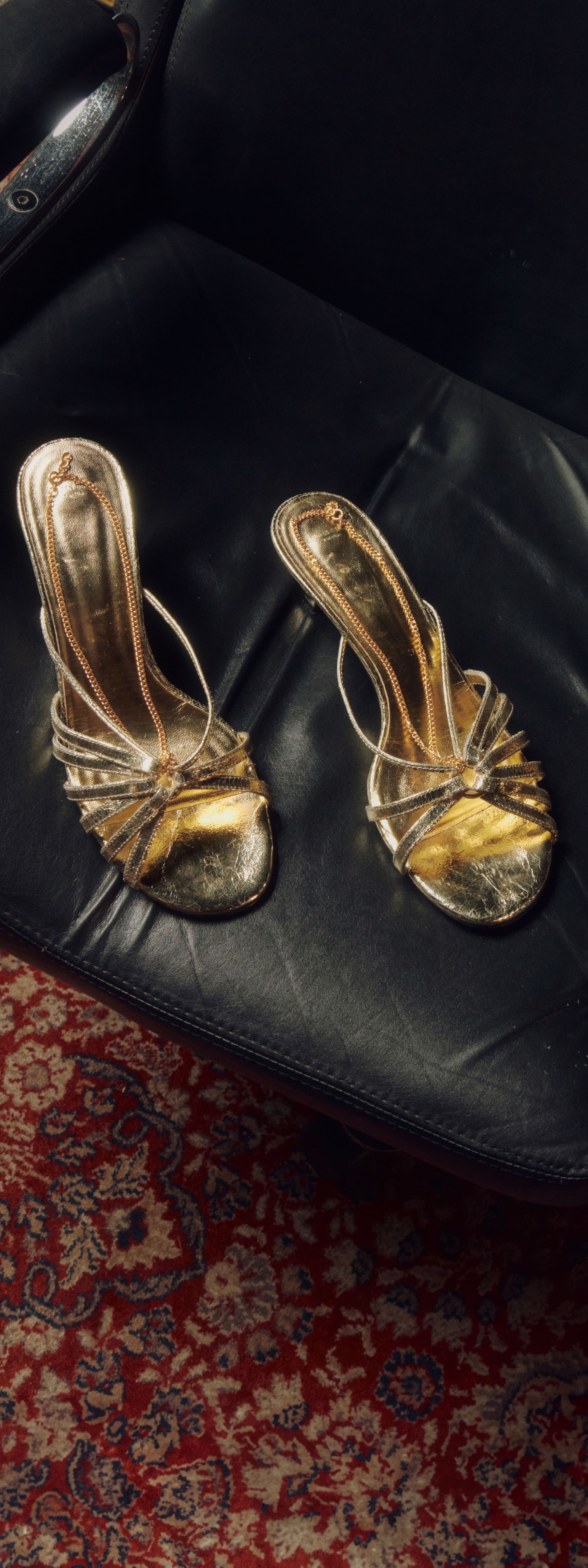 gold-sandals-on-a-chair
