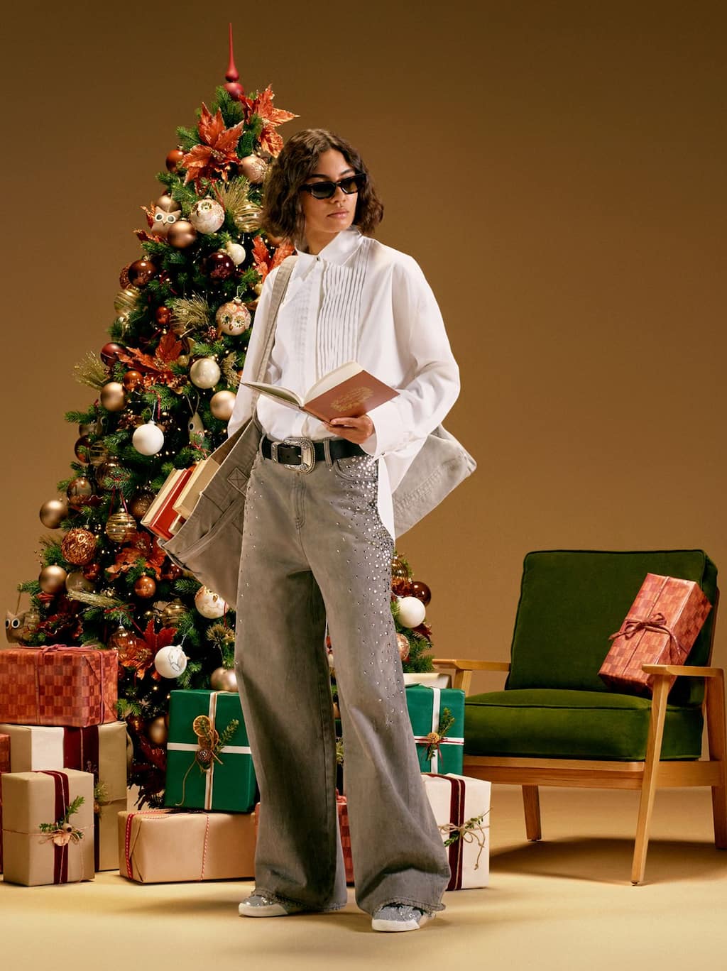 female-model-in-front-of-christmas-tree-reading-a-book