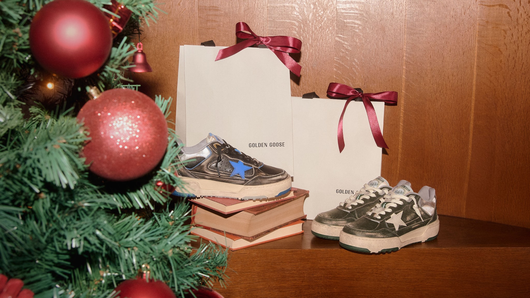 two-pair-of-forty2-sneakers-close-to-some-shopping-bags-and-a-christmas-tree