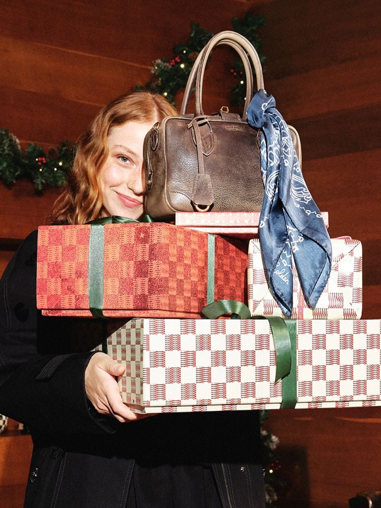 female-model-with-christmas-gifts