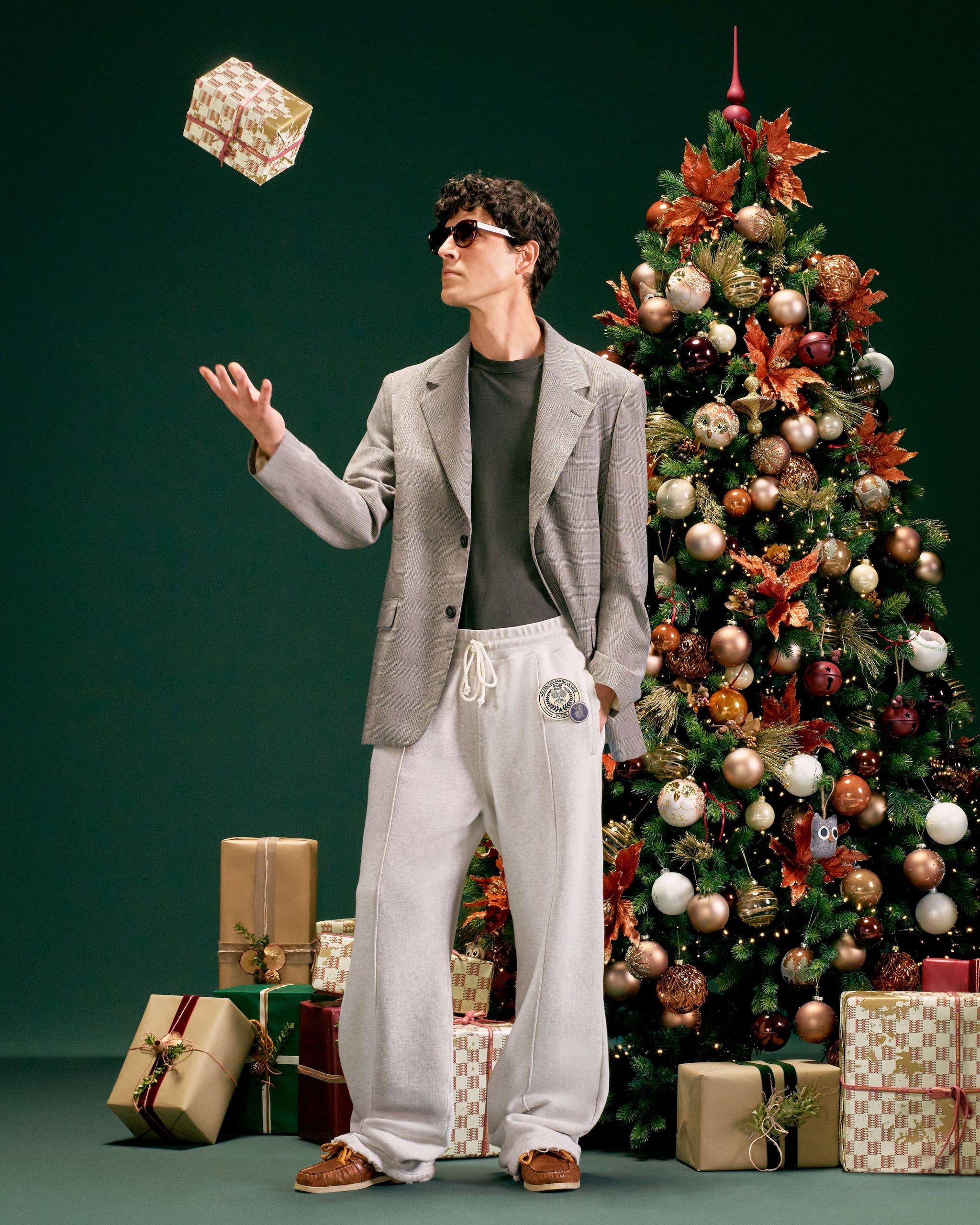 male-model-with-a-christmas-three-and-a-gifts