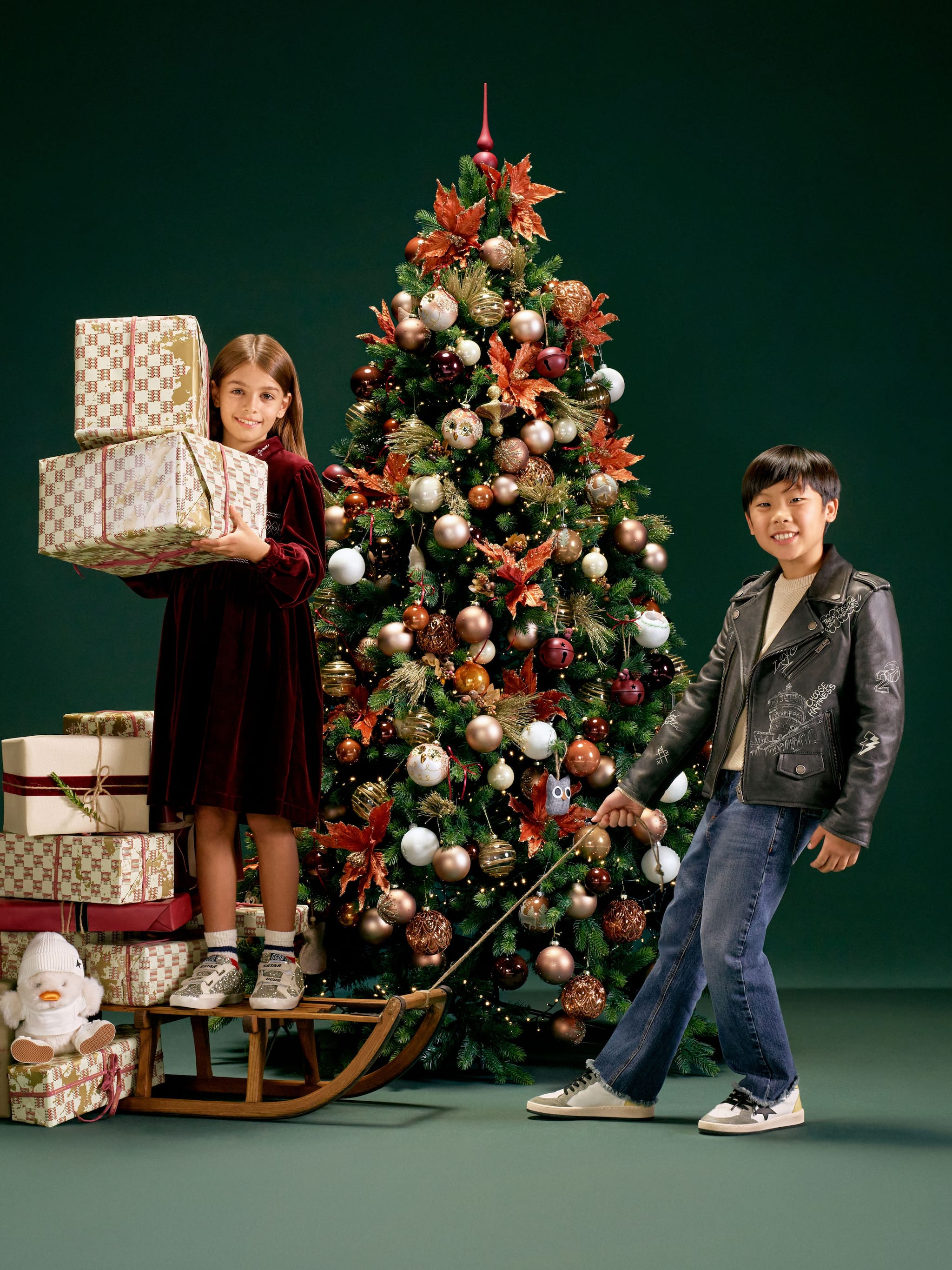 little-girl-and-boy-with-a-christmas-three-and-some-gifts