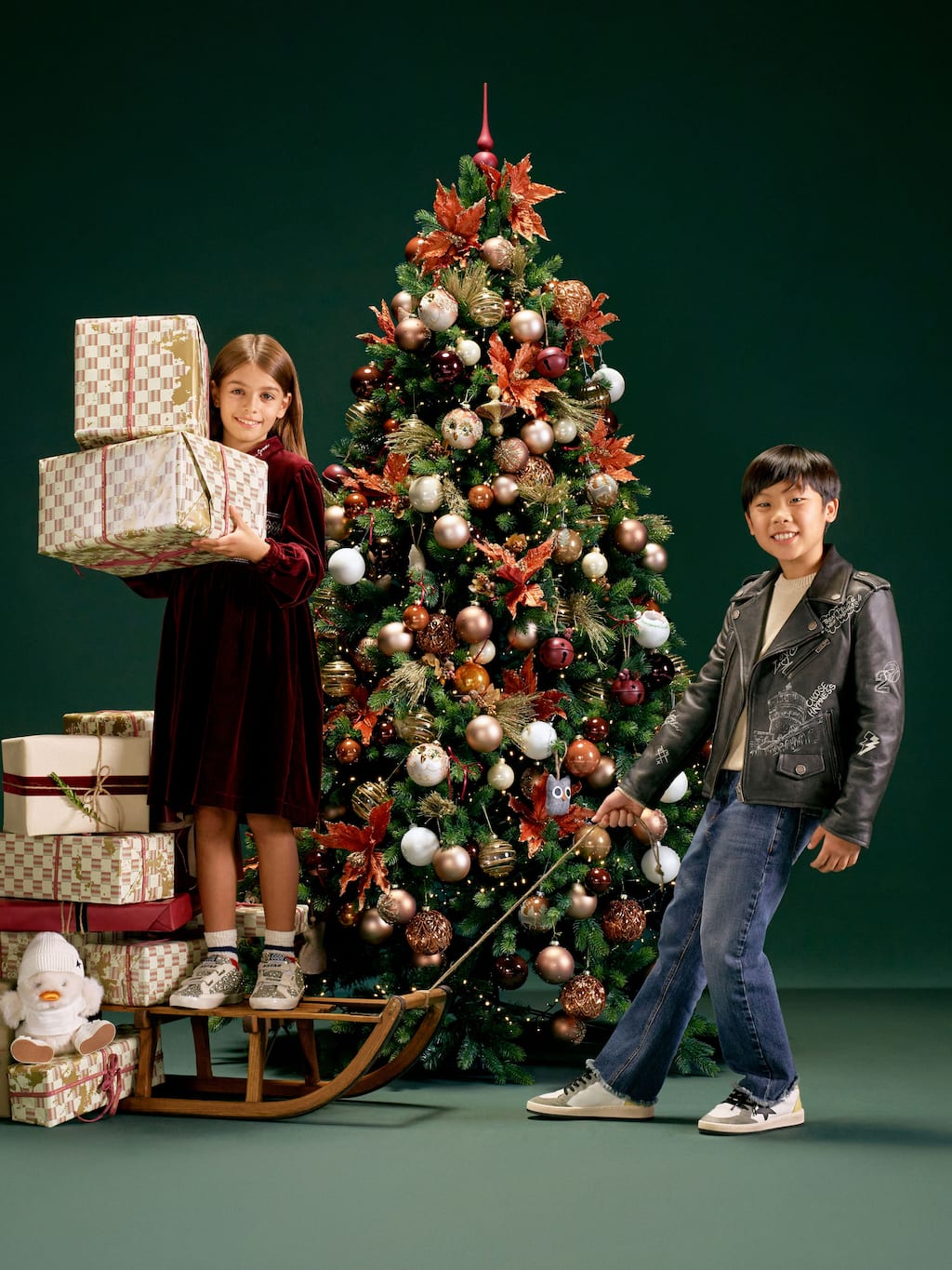 little-girl-and-boy-with-a-christmas-three-and-some-gifts