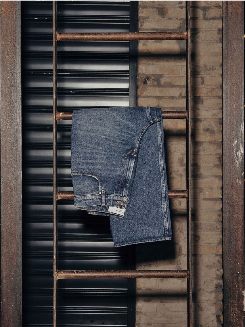 blue-jeans-hanging-on-a-iron-staircase