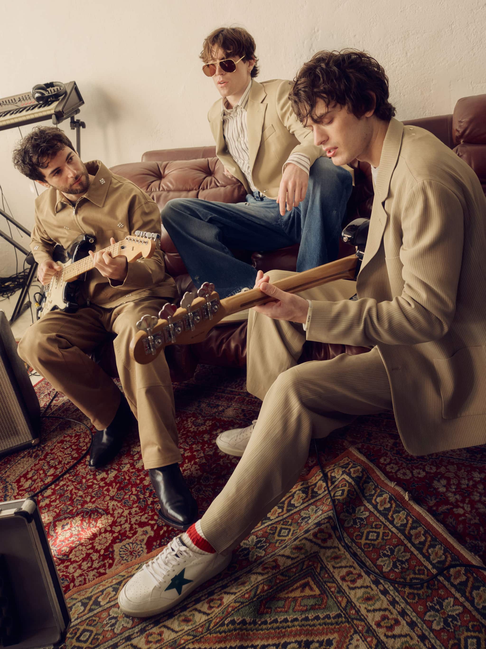musicians-on-sofa-with-guitars-and-keyboard