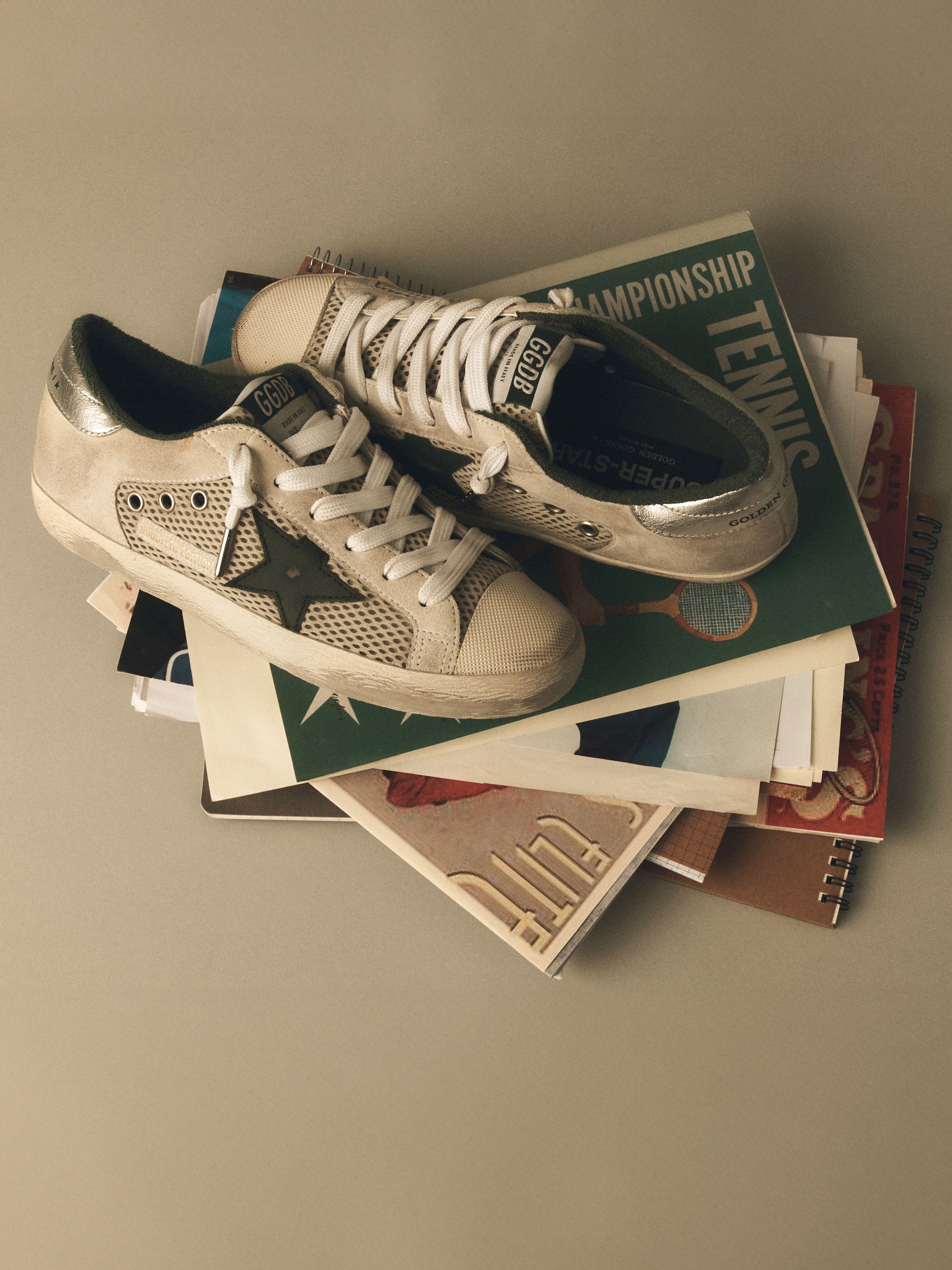 super-star-white-with-green-details-on-a-magazine