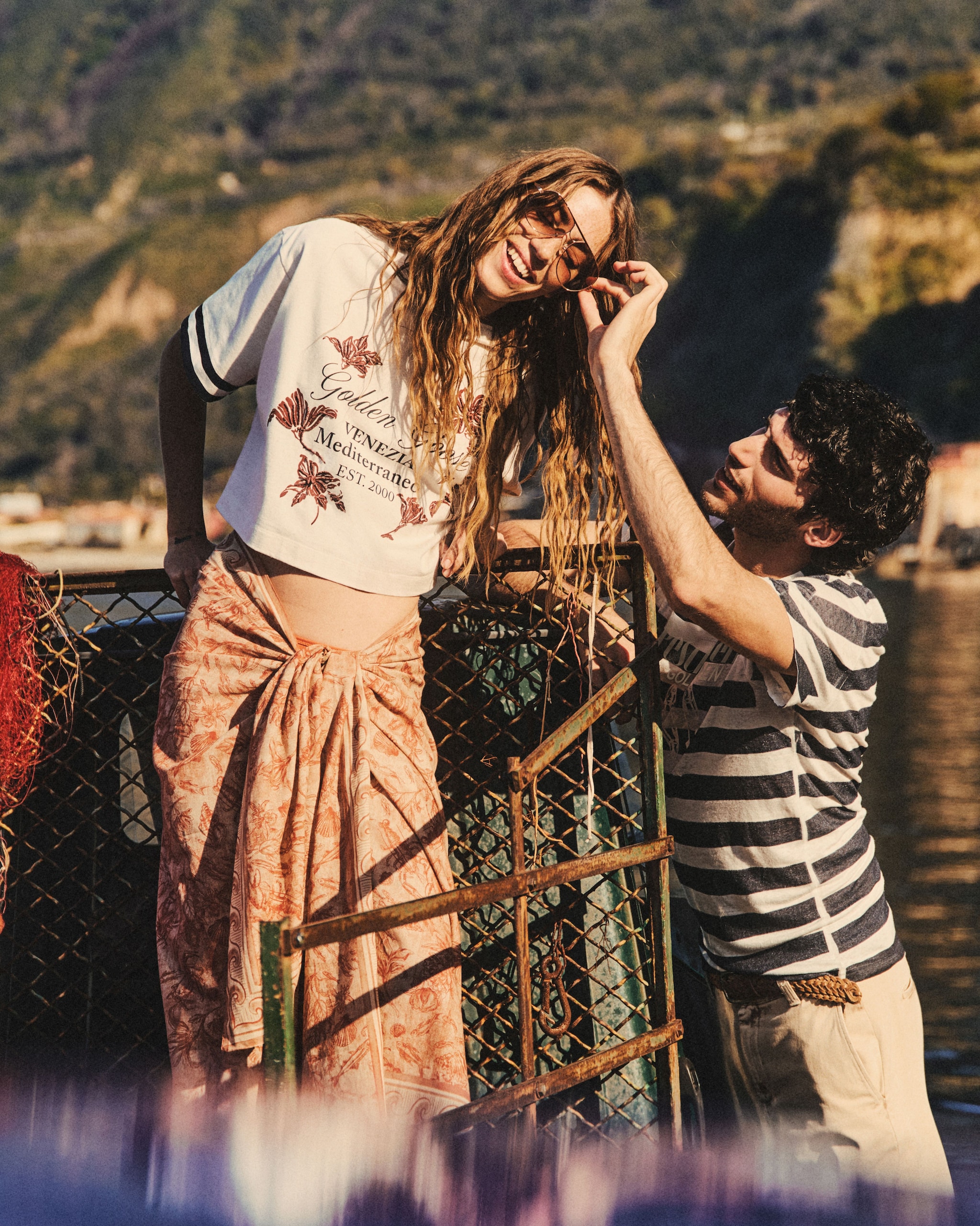 boy-and-girl-laughing-on-a-boat