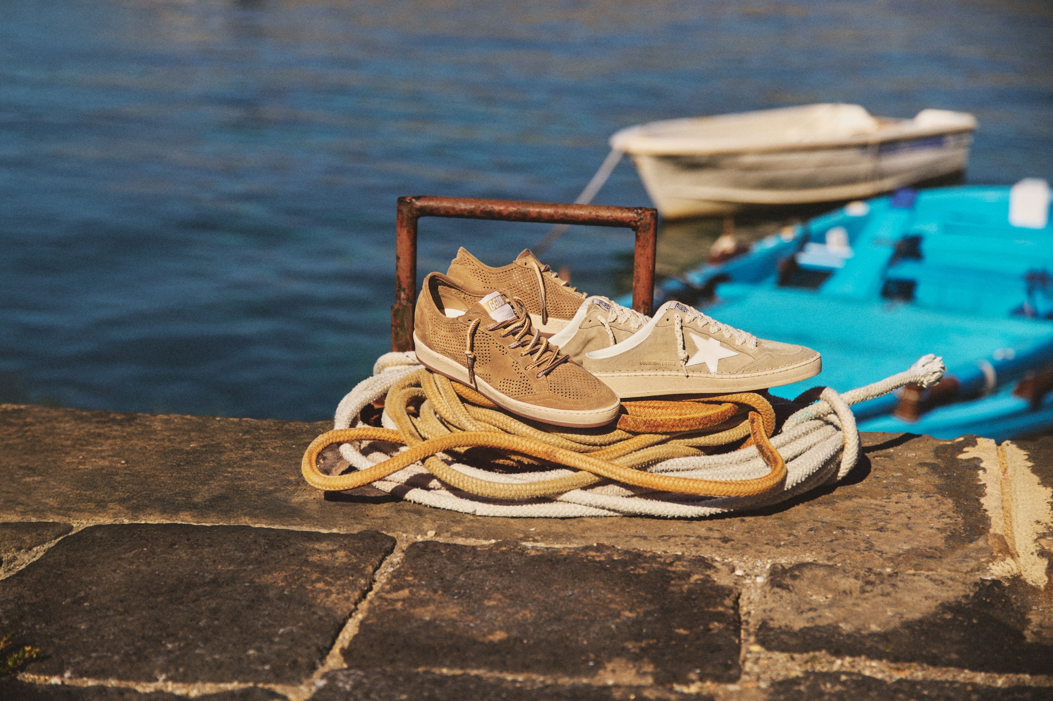 beige-sneakers-resting-on-top-of-a-fishing-line