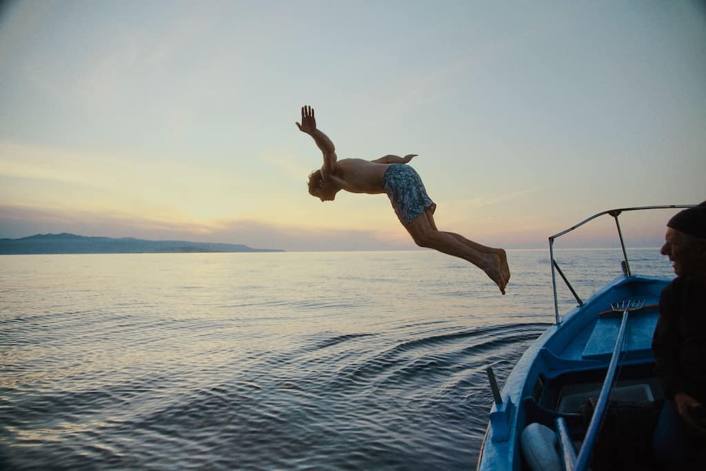boy-diving-from-a-boat