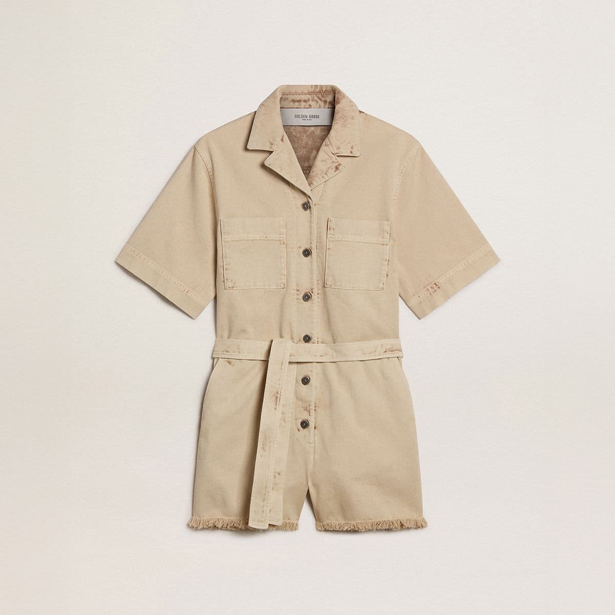 beige-women’s-short-sleeve-denim-romper-with-belt-and-frayed-hem-on-neutral-background
