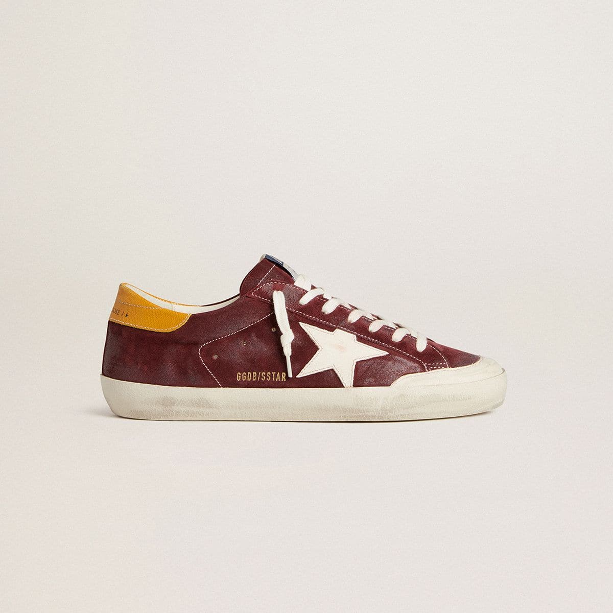 Men’s-Super-Star-in-brick-red-suede-with-white-leather-star-and-animal-print-heel-tab