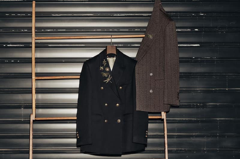 embroidered-and-striped-blazers-on-wood-ladder