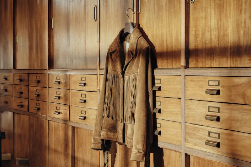 beige-leather-jacket-hanging-on-a-wall