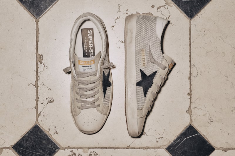 white-super-star-sneakers-with-blue-star-on-the-floor