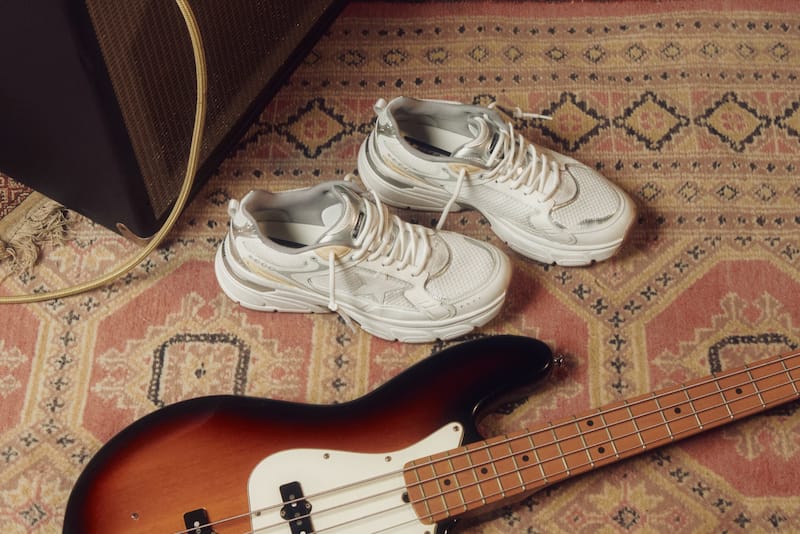 white-lightstar-sneakers-on-the-floor-close-to-a-electric-guitar