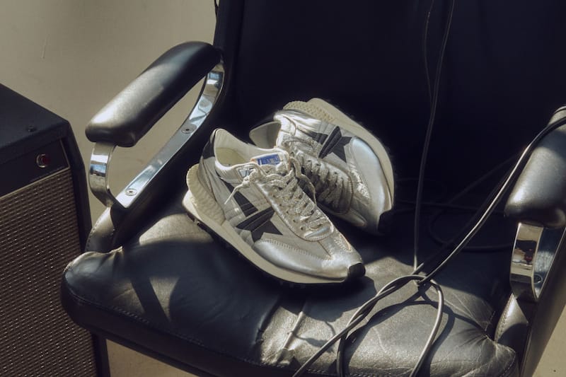 silver-marathon-sneakers-on-a-black-leather-chair