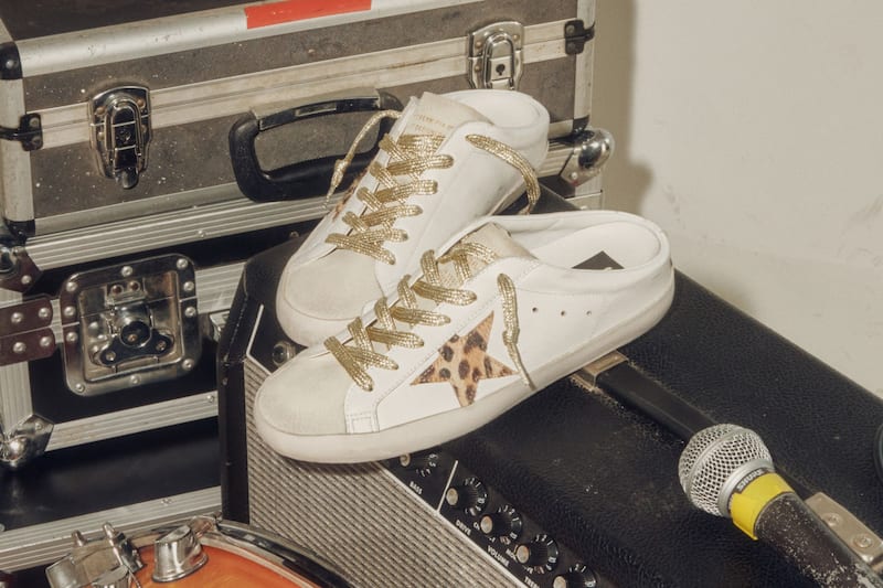 white-mule-sneakers-with-gold-laces-on-amp-near-mic