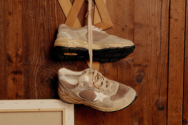 dad-star-sneakers-hanging-on-a-wall