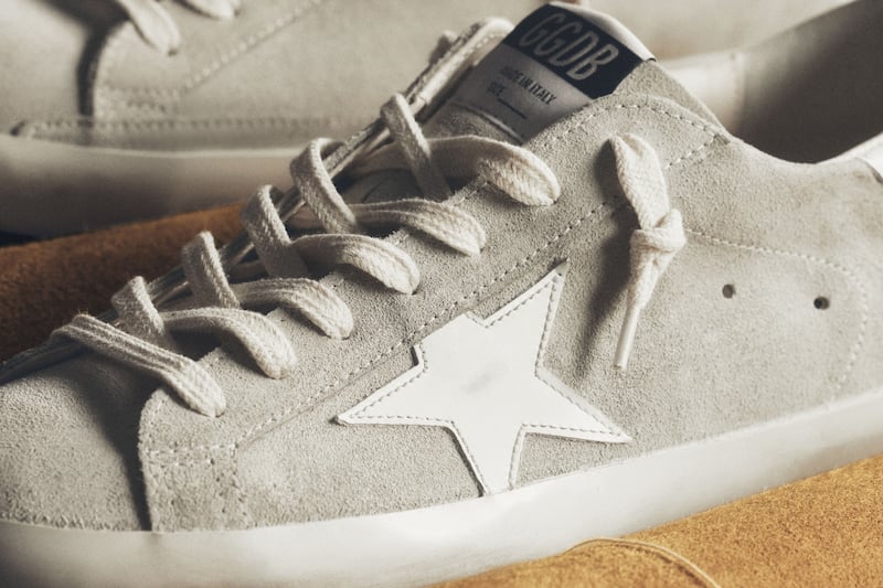 two-suede-sneakers-on-a-sofa