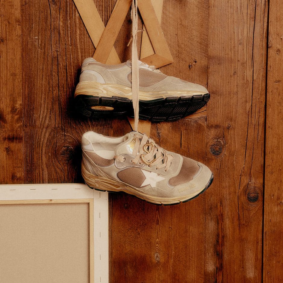 running-sneakers-hanging-on-a-wall