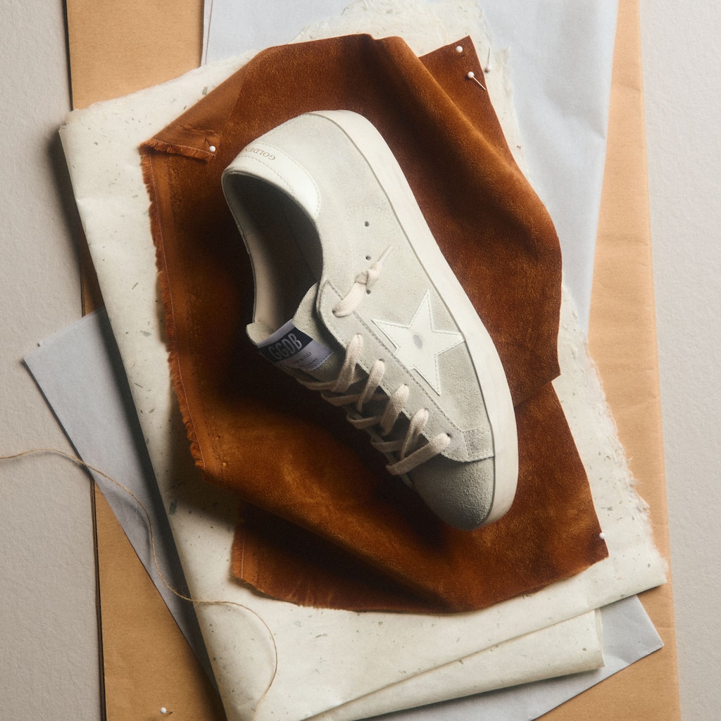 running-sneakers-hanging-on-a-wall