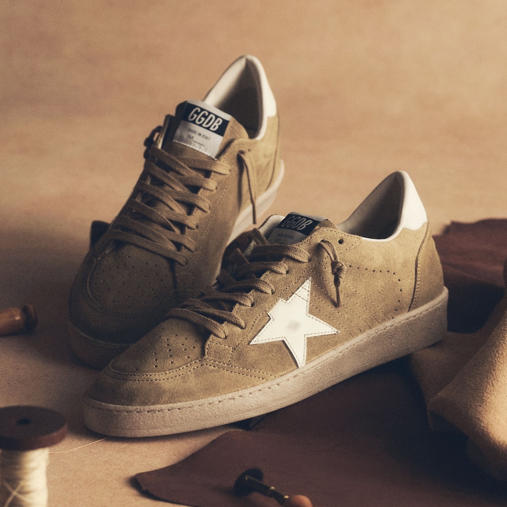 running-sneakers-hanging-on-a-wall