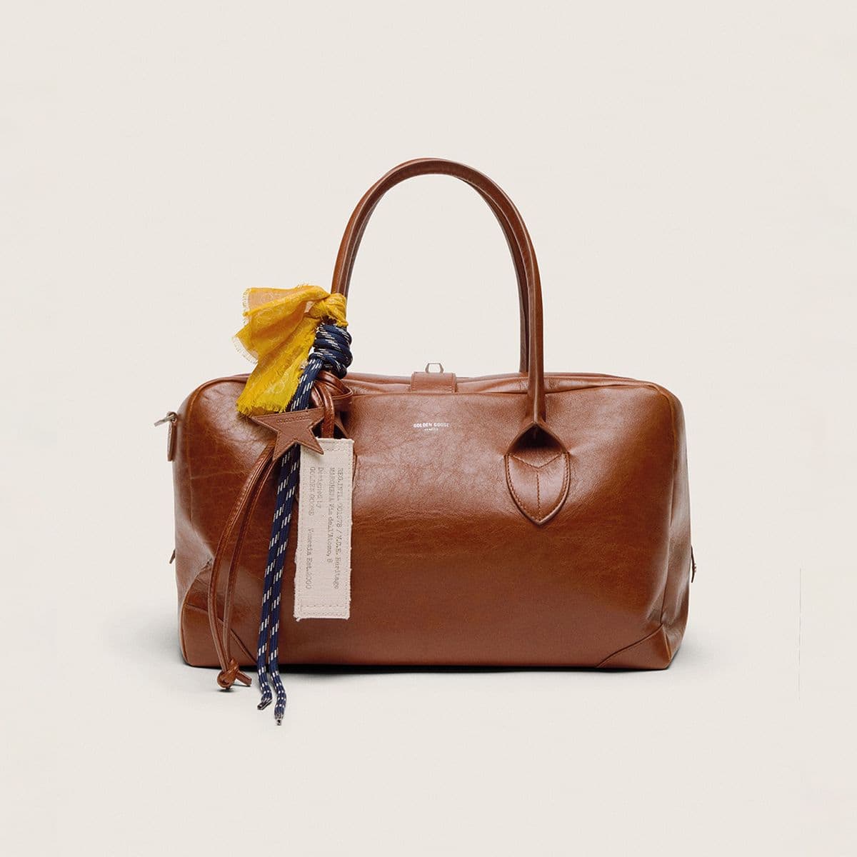 leather-vita-bag-with-charms-applied