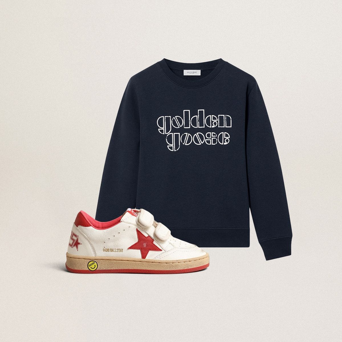 kids-sneakers-and-shirt-on-a-blue-background