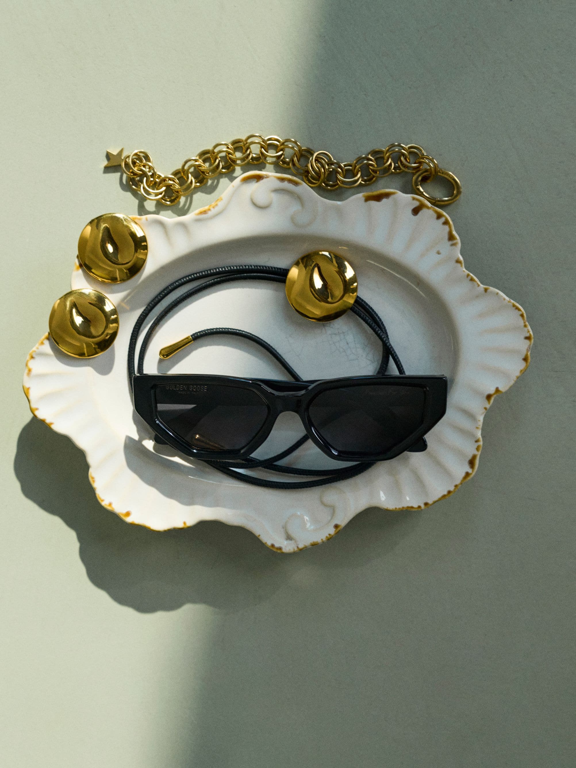 group-holding-model-bobby-banks-up-in-the-air-with-screen-in-the-background