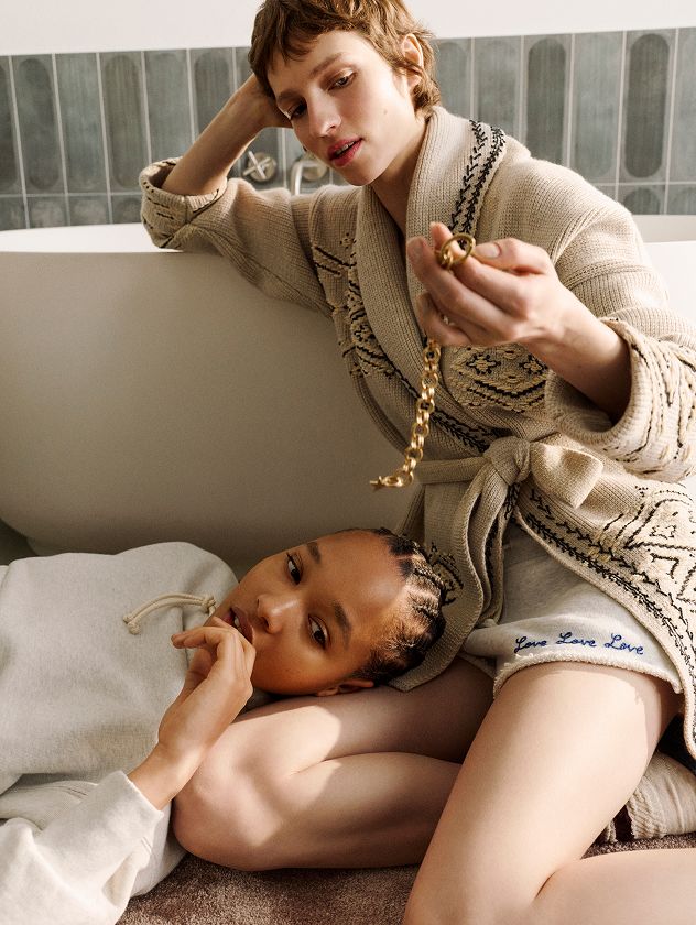 two-girls-laying-on-the-floor-in-their-bedroom