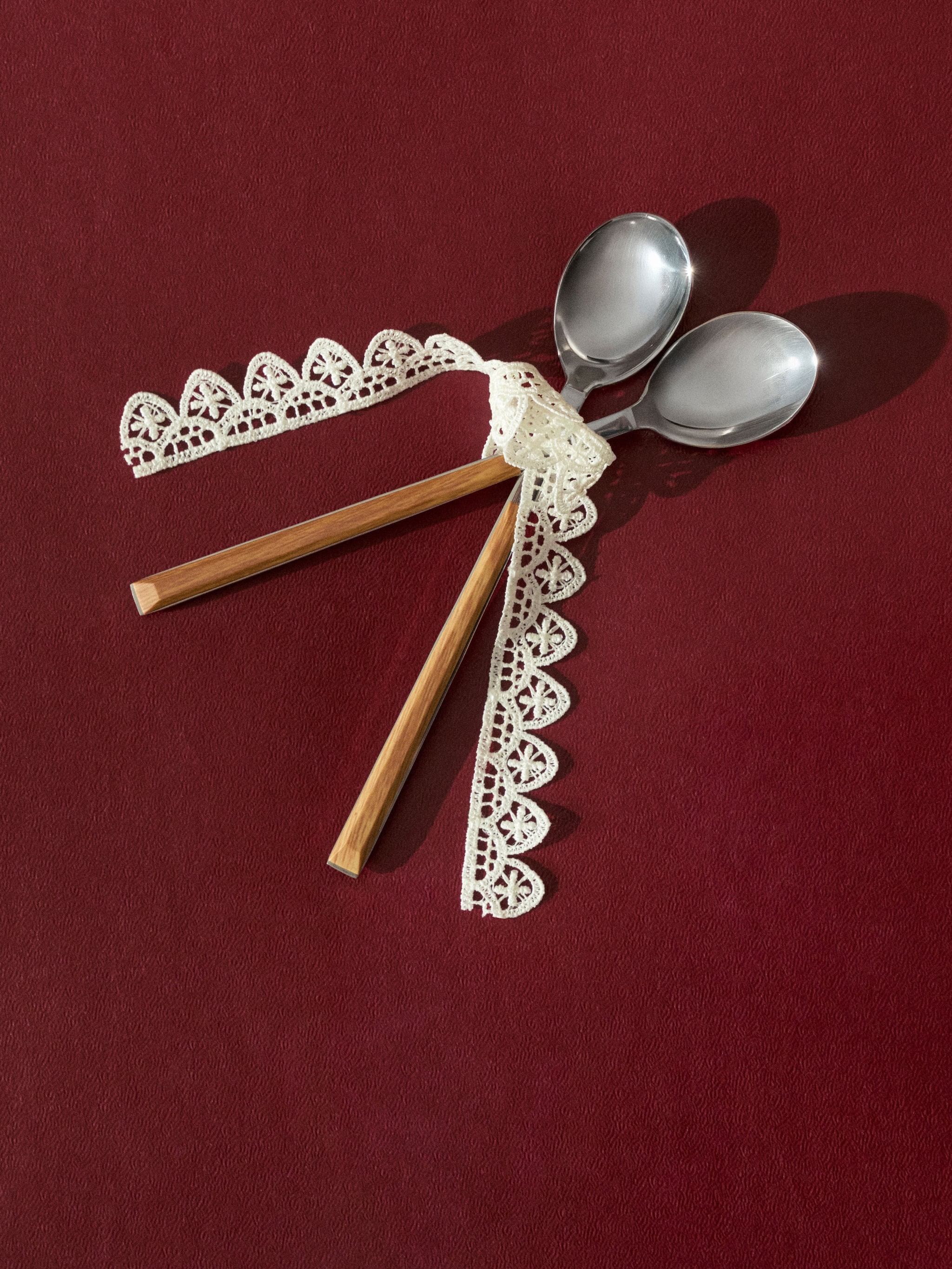 two-spoons-on-a-red-carpet-laced-up