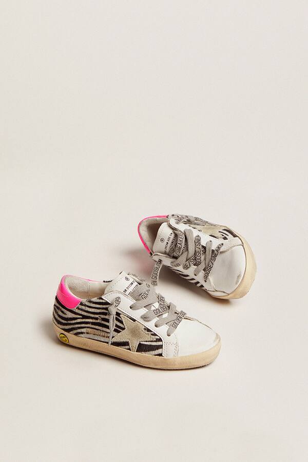 Golden Goose - Junior Super-Star in leather and zebra-print pony skin with fuchsia heel tab in 