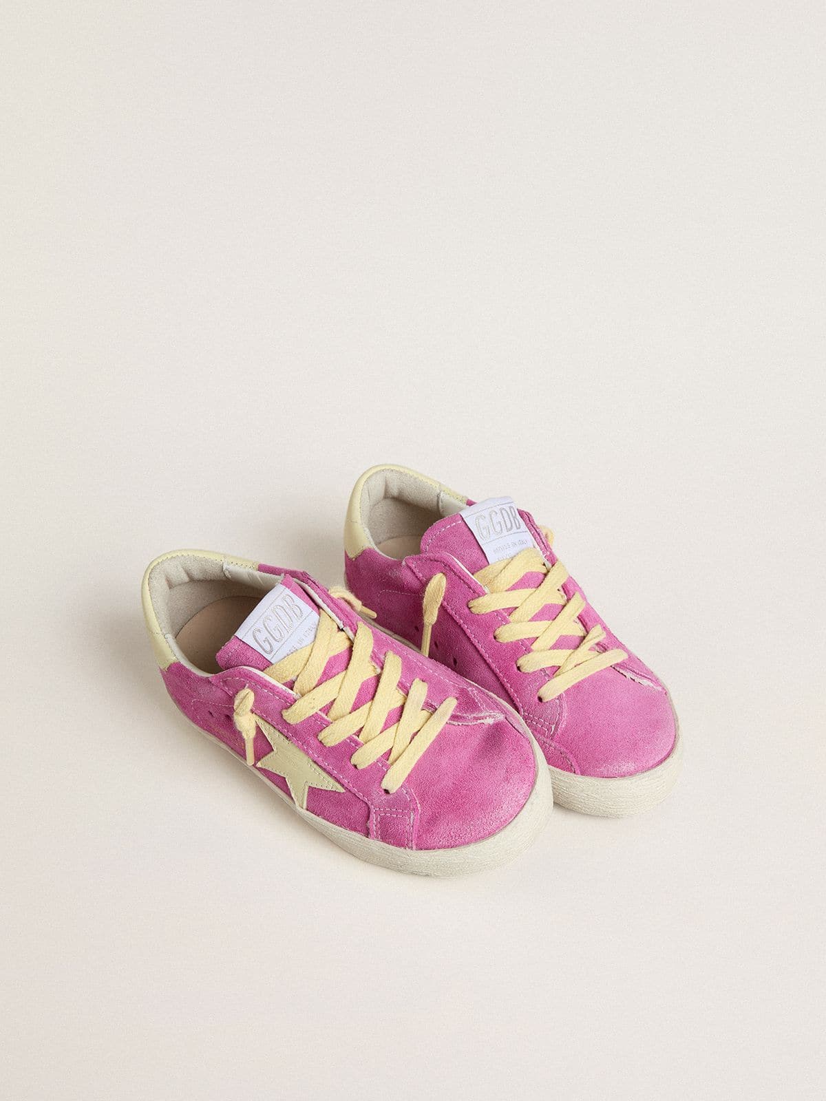 Junior Super-Star in pink suede with light yellow star and heel tab 