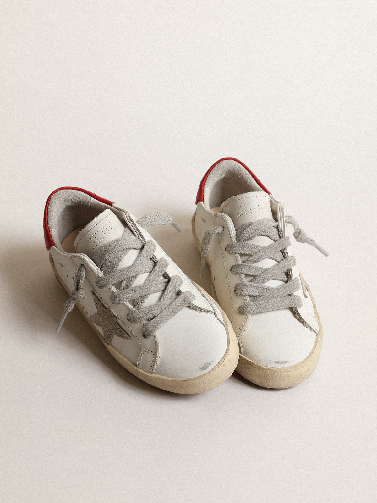 Golden Goose - Super-Star Junior with suede star and red leather heel tab in 