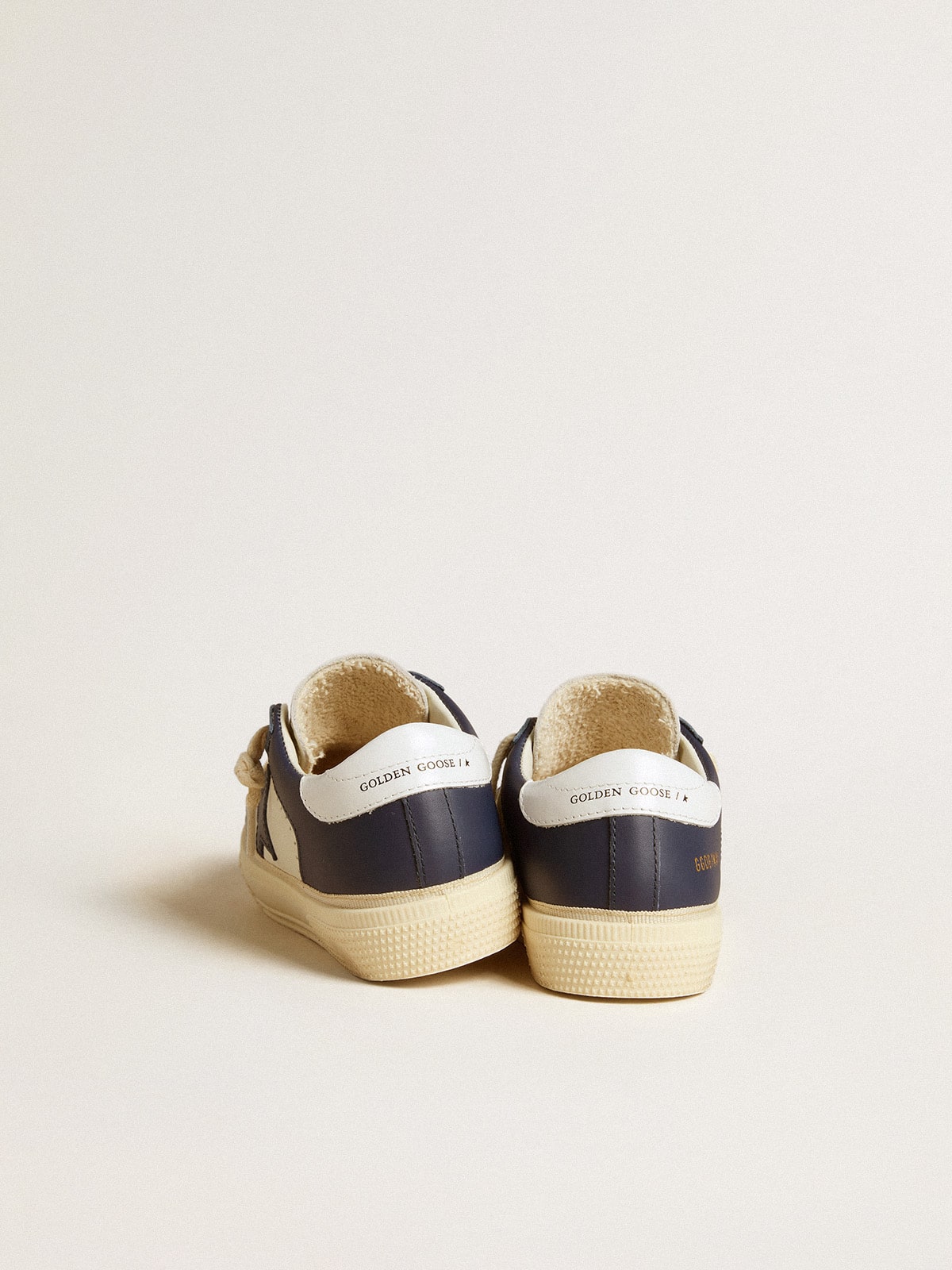 May Junior in white and blue leather with leather star and