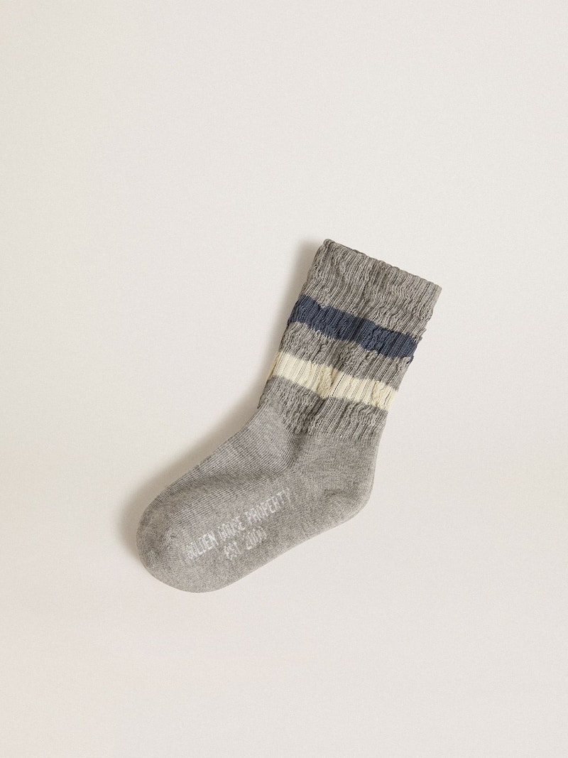 Kids’ gray socks with distressed details and worn-white and blue stripes