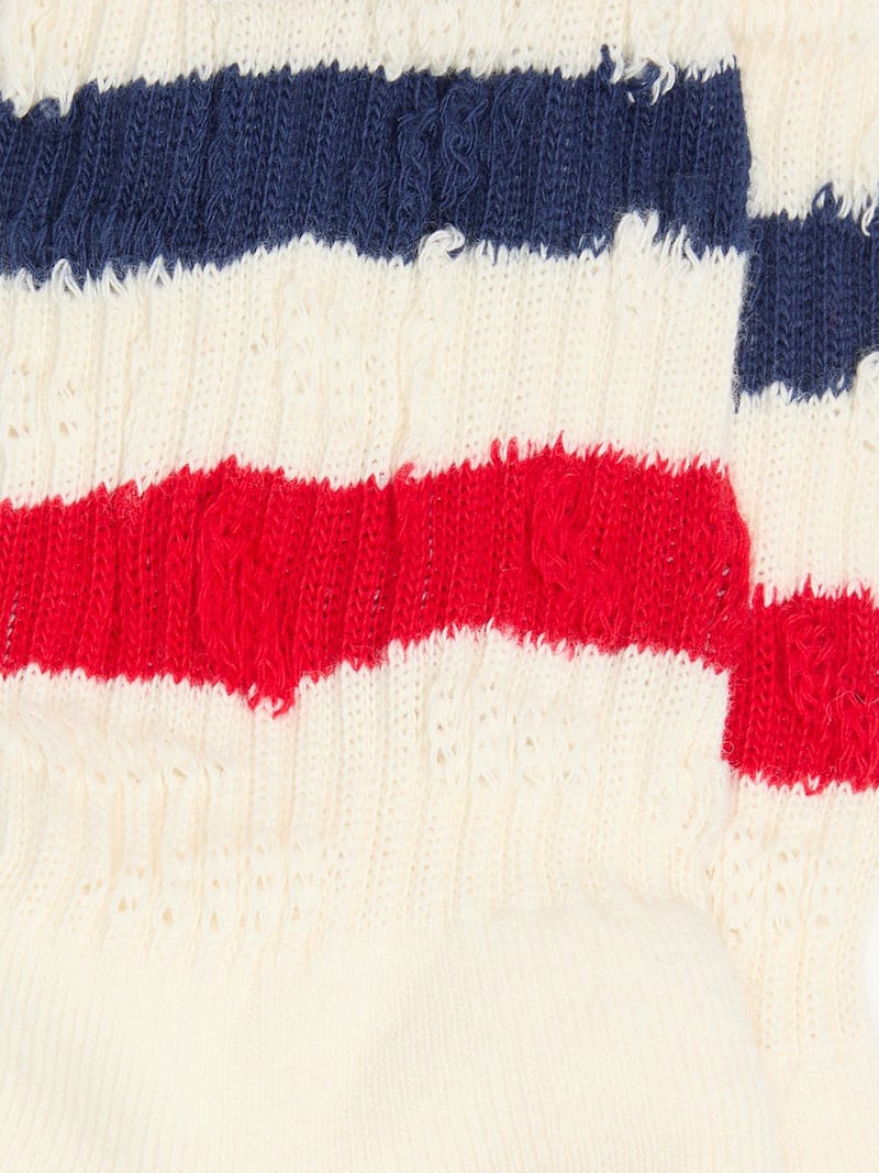 Socks in distressed-finish white cotton with red and navy stripes